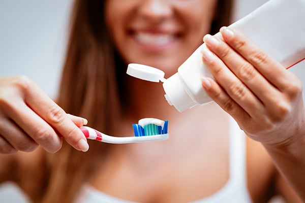 View of a sterilization room with a dental assistant using an autoclave.